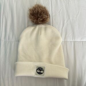 Timberland Off-White Beanie with Fuzzy Brown Pom